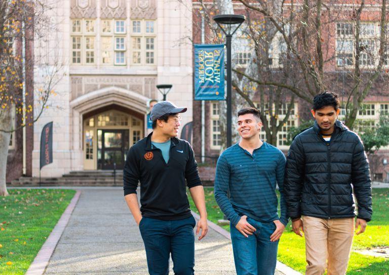 students walk in front of Knoles Hall