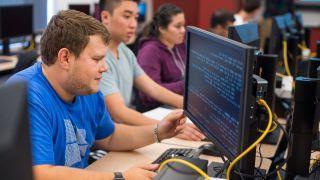 Students working on code.