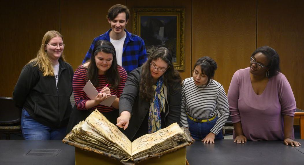 music history professor and students in library