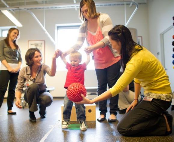 PT students working with child in clinic